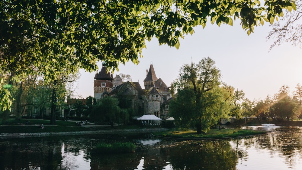 a large building sitting on top of a lush green field