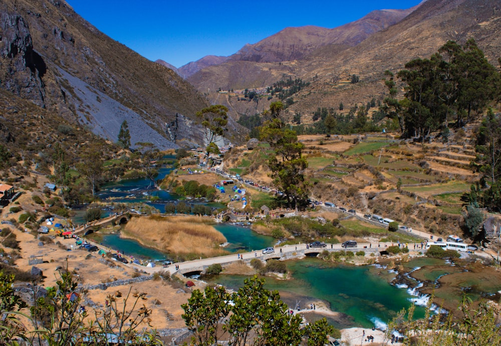 a valley filled with lots of green water surrounded by mountains