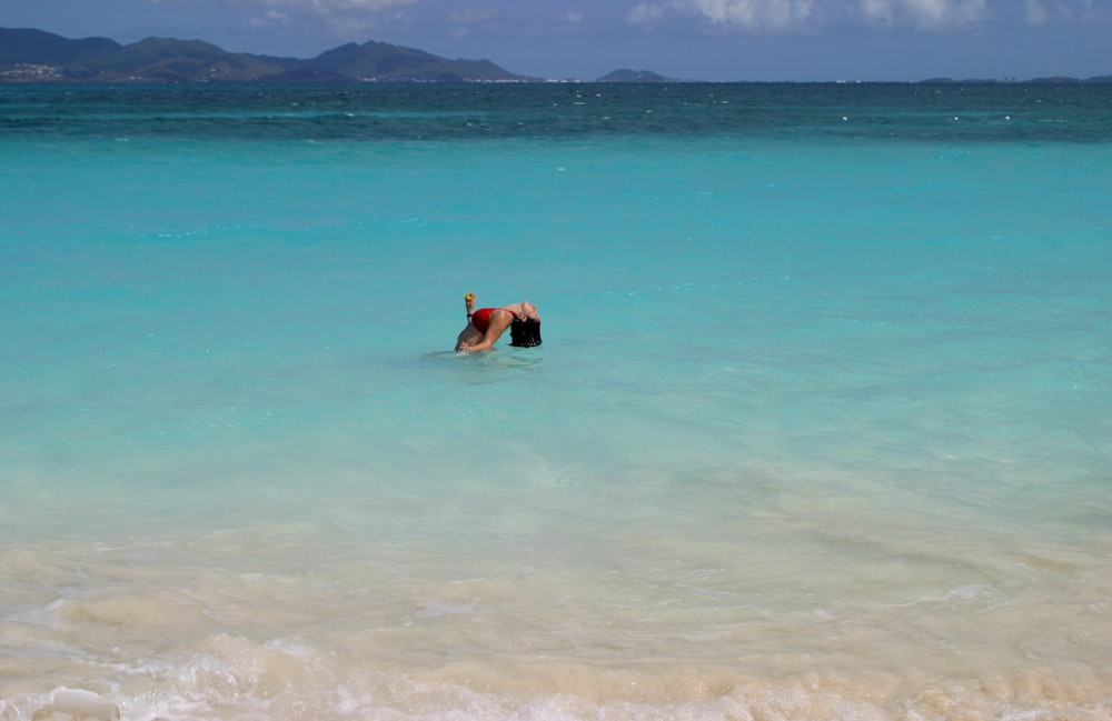 a person swimming in a body of water