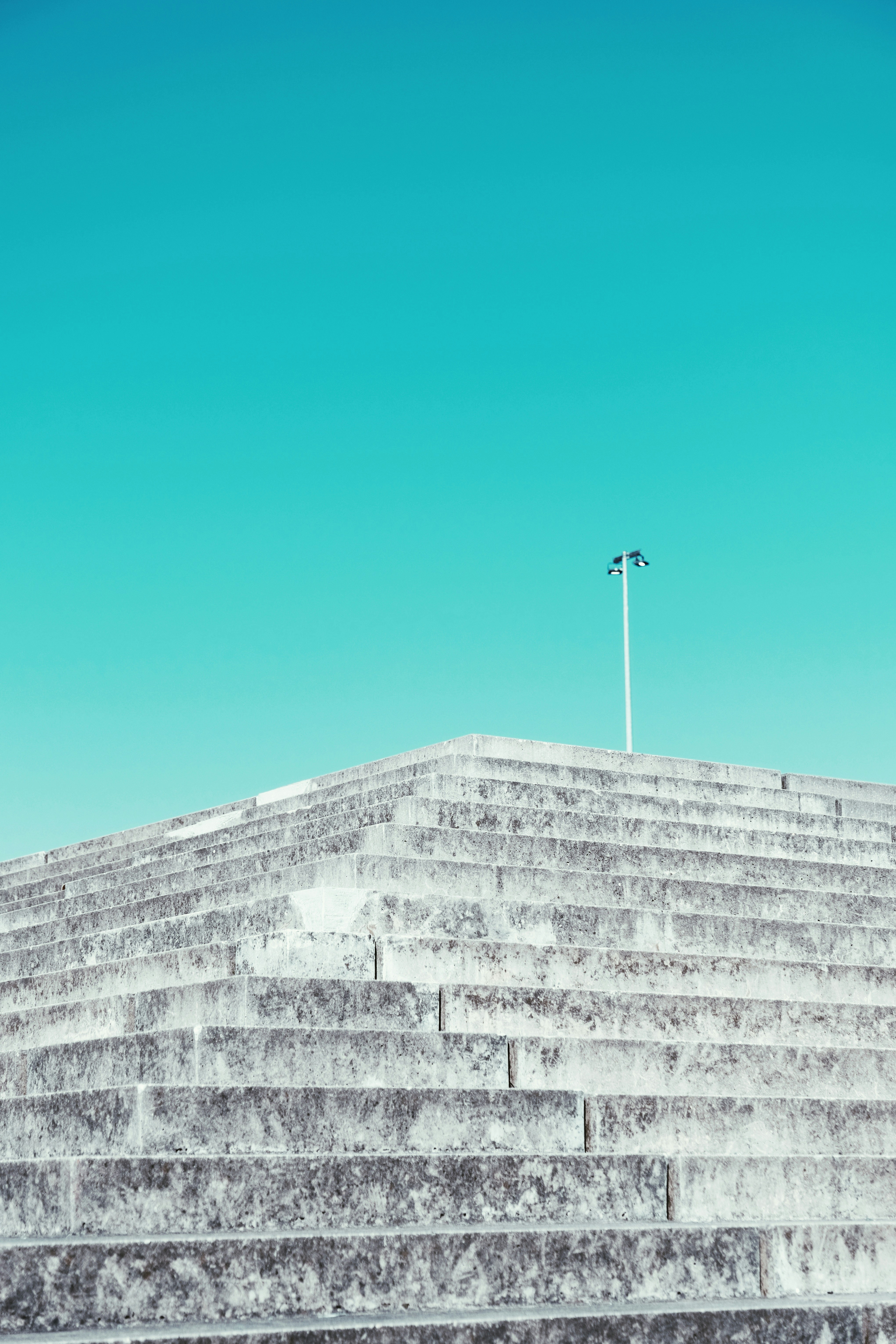 a man riding a skateboard down the side of a set of stairs