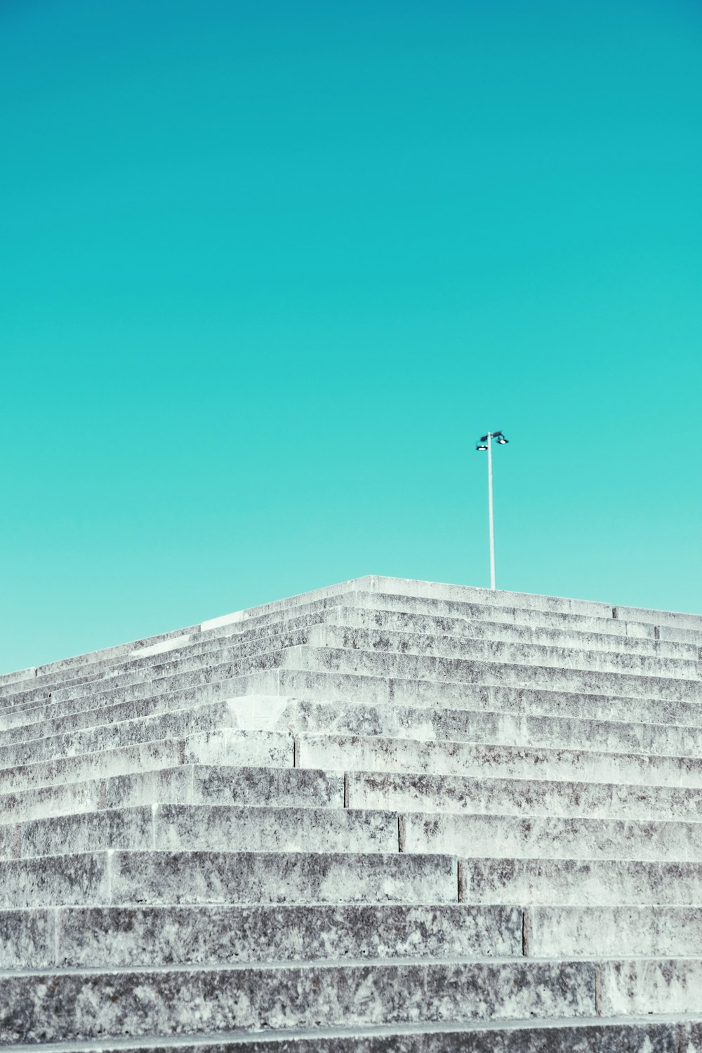 a man riding a skateboard down the side of a set of stairs