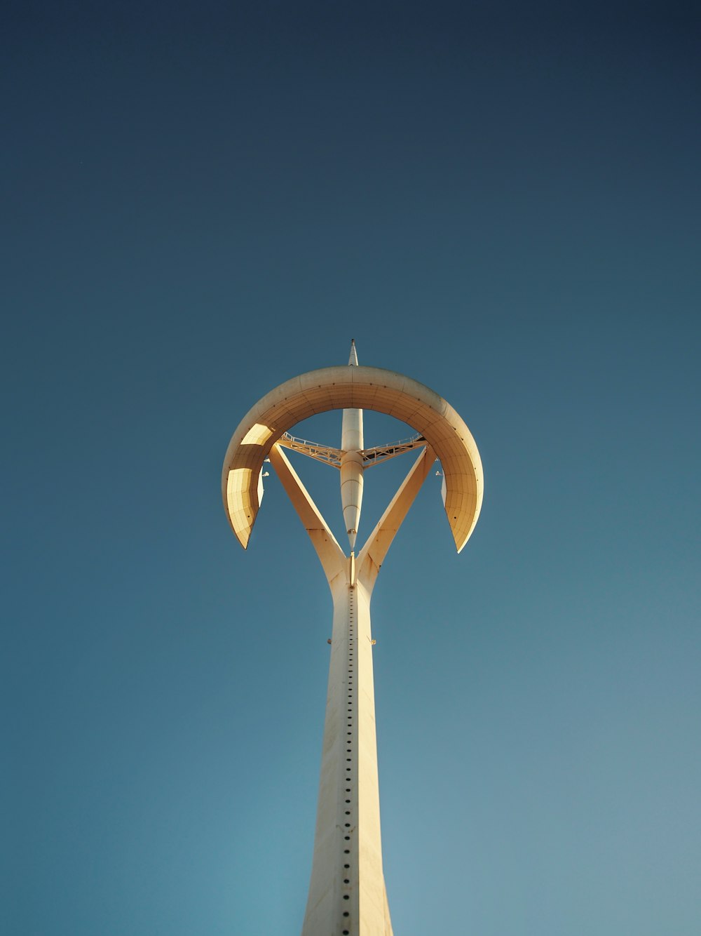 a tall white tower with a sky background