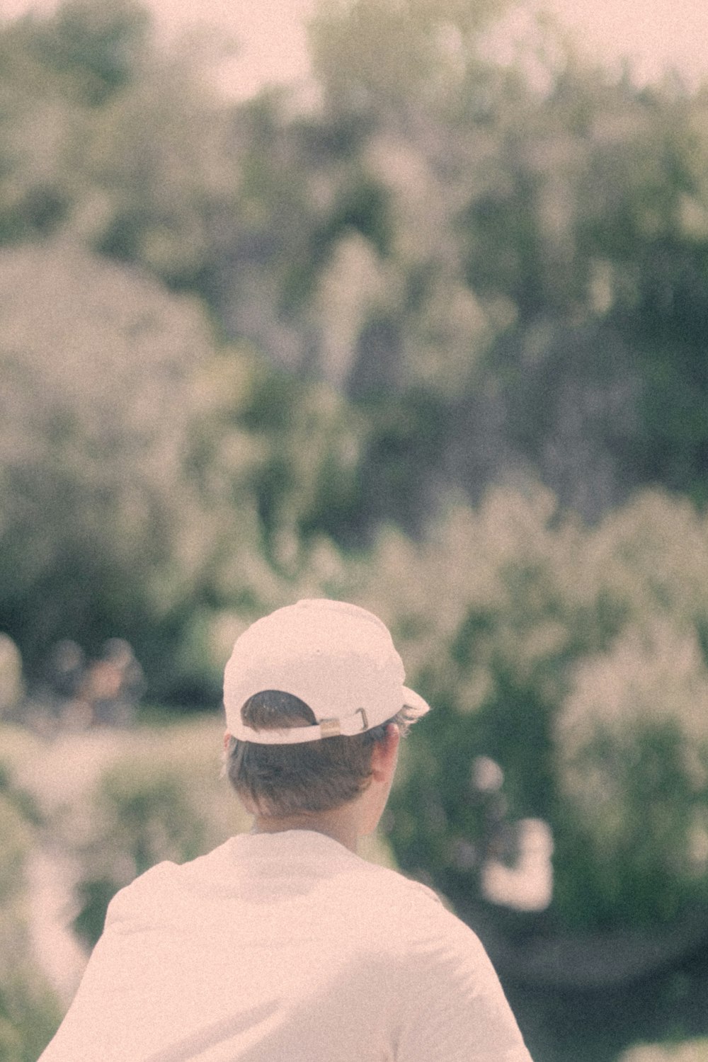 a man wearing a hat and sunglasses