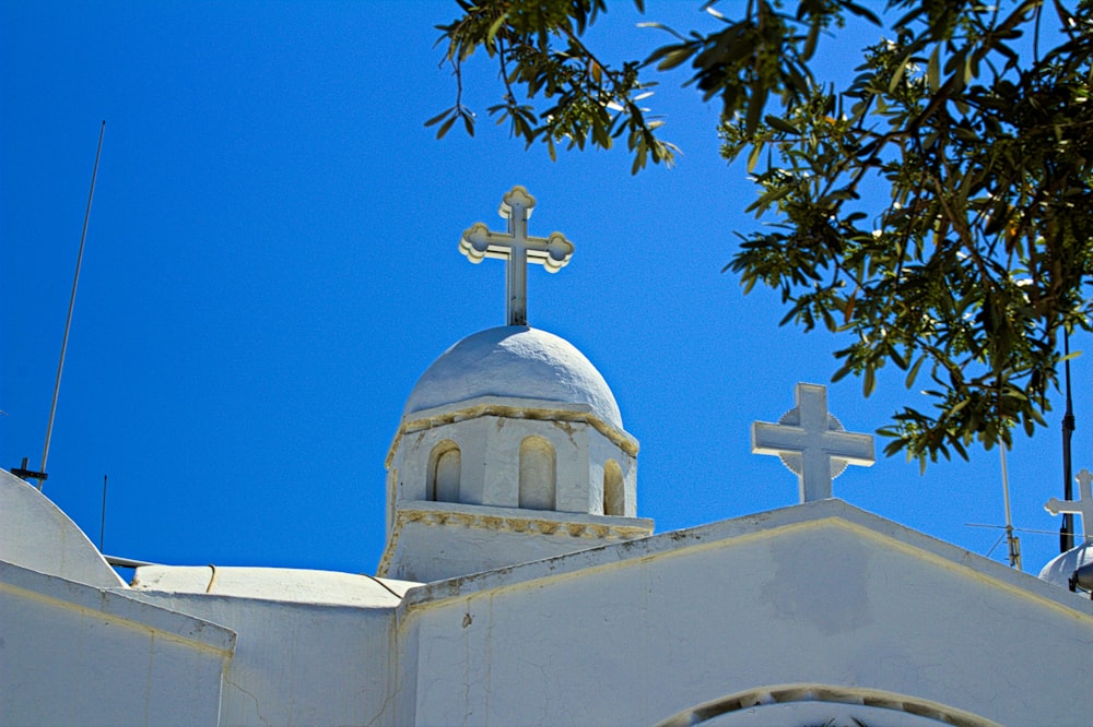 a white building with a cross on top of it