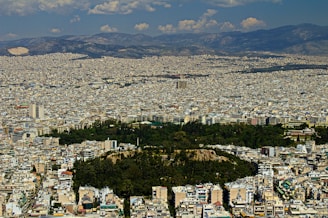a view of a city from the top of a hill