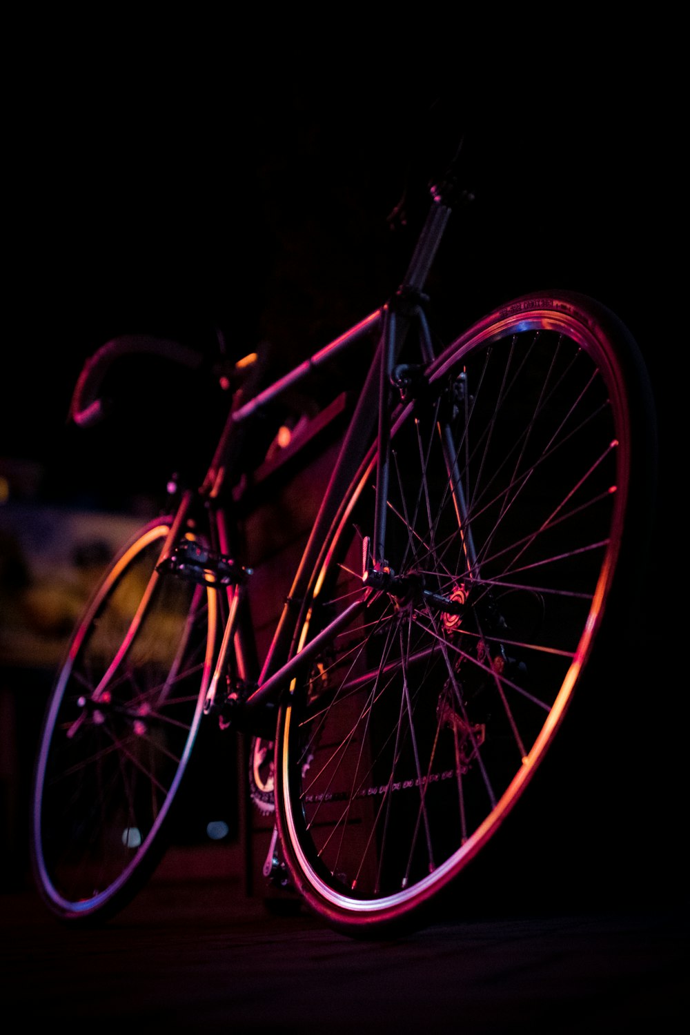 a close up of a bike in the dark
