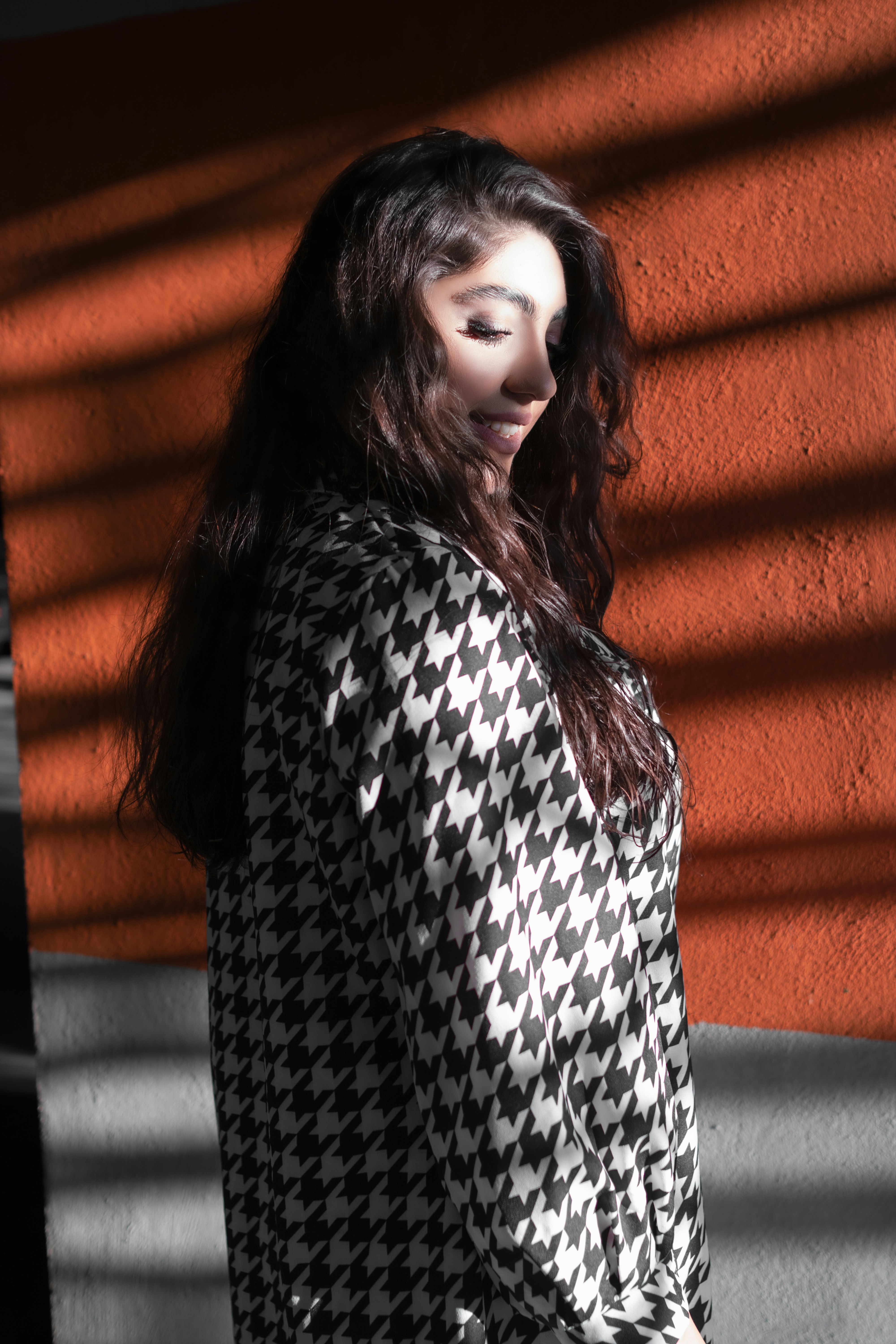 A woman is standing in front of a wall photo – Free Tehran Image on ...