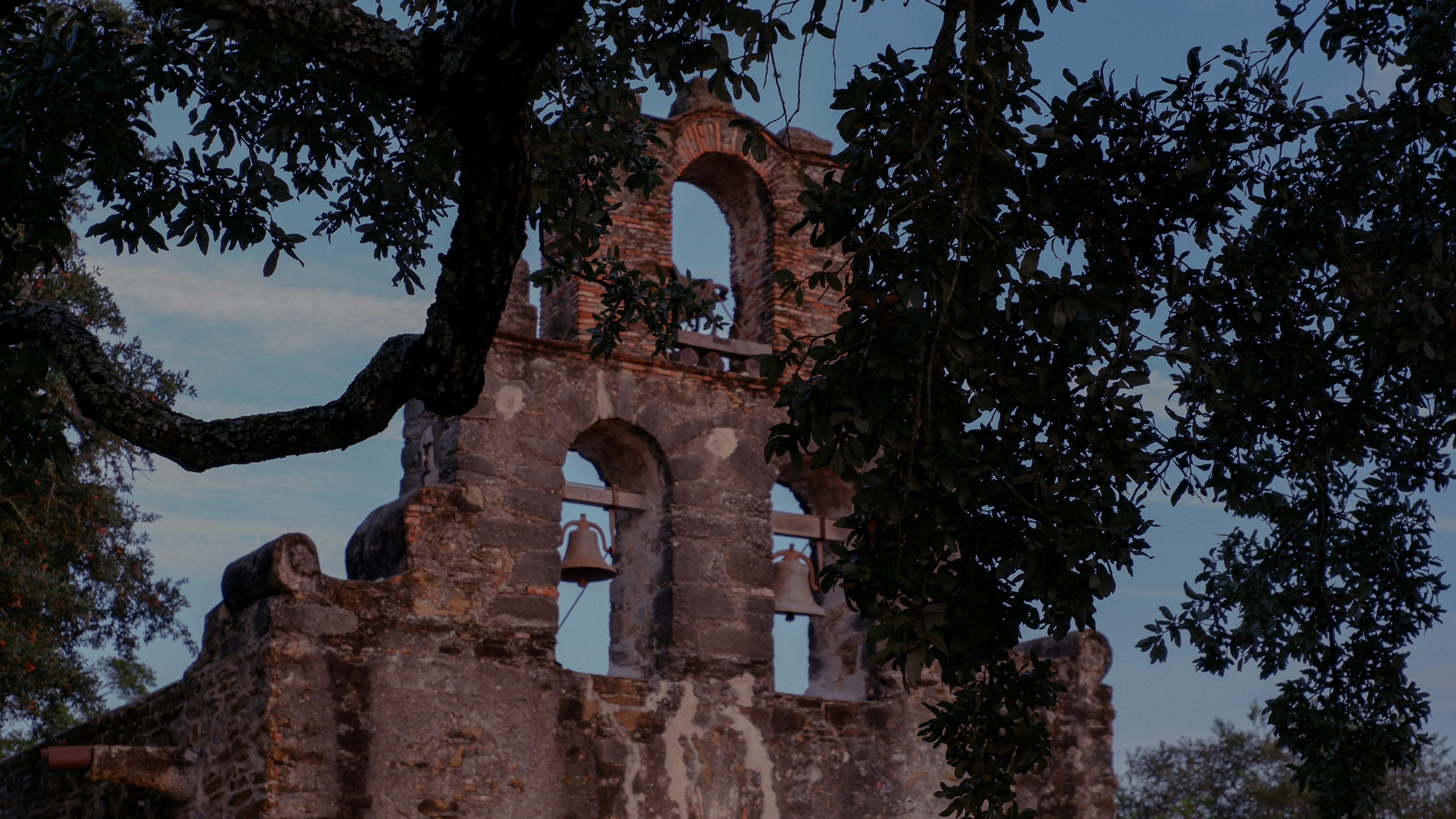 a very old building with a clock on the side of it