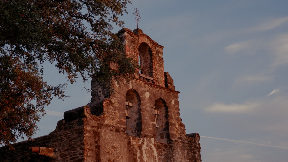 a tall tower with a clock on the top of it