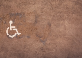 a handicap sign painted on the side of a wall