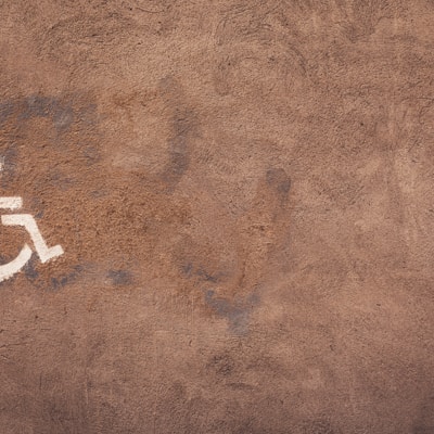 a handicap sign painted on the side of a wall