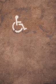 a handicap sign is painted on the ground