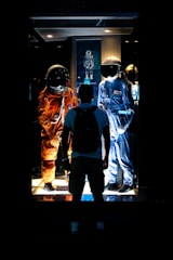 a group of people standing in front of a window