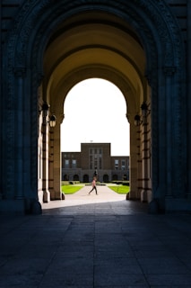 a person walking under an archway in a building