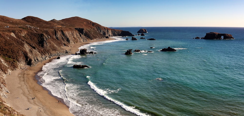 a view of the beach and cliffs of the ocean