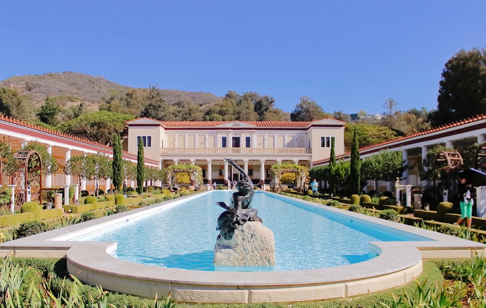 a fountain in front of a large building