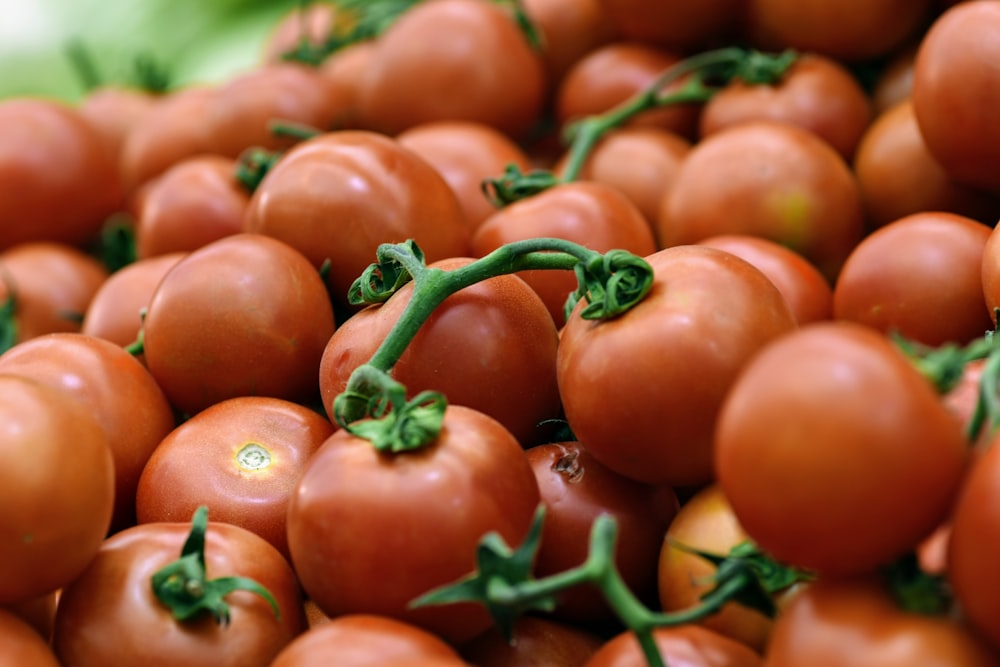 a pile of tomatoes sitting on top of each other