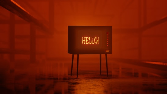 A retro television set displaying the word 'HELLO!' stands in a dimly lit, orange-hued environment. The room has an industrial feel with metal railings on either side, creating a symmetrical perspective leading to the TV.