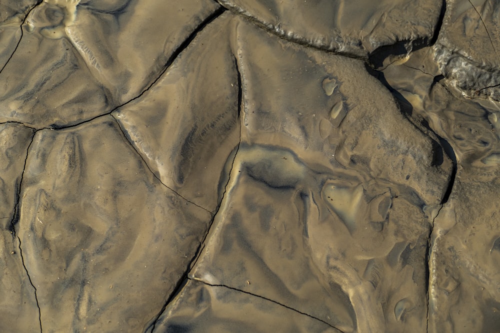 an aerial view of a muddy river bed
