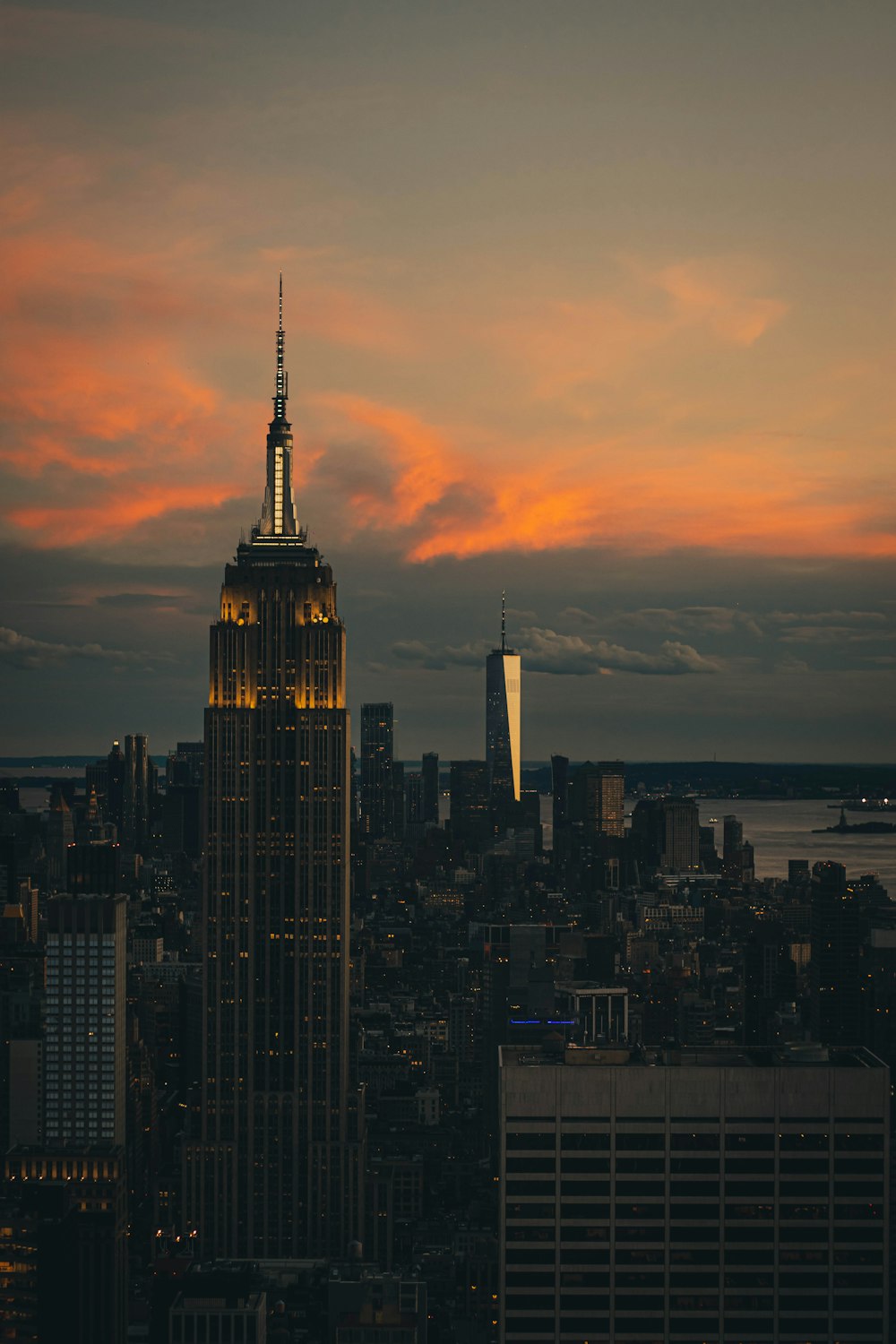 a view of a very tall building with a sunset in the background