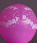 Bright balloon bouquets enhancing a fun birthday party atmosphere.