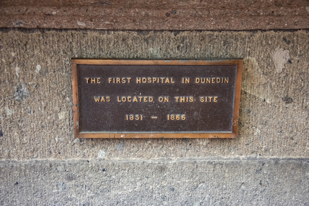 a plaque on the side of a building