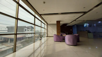 A calm, modern consultation room with natural light and accessible design elements.