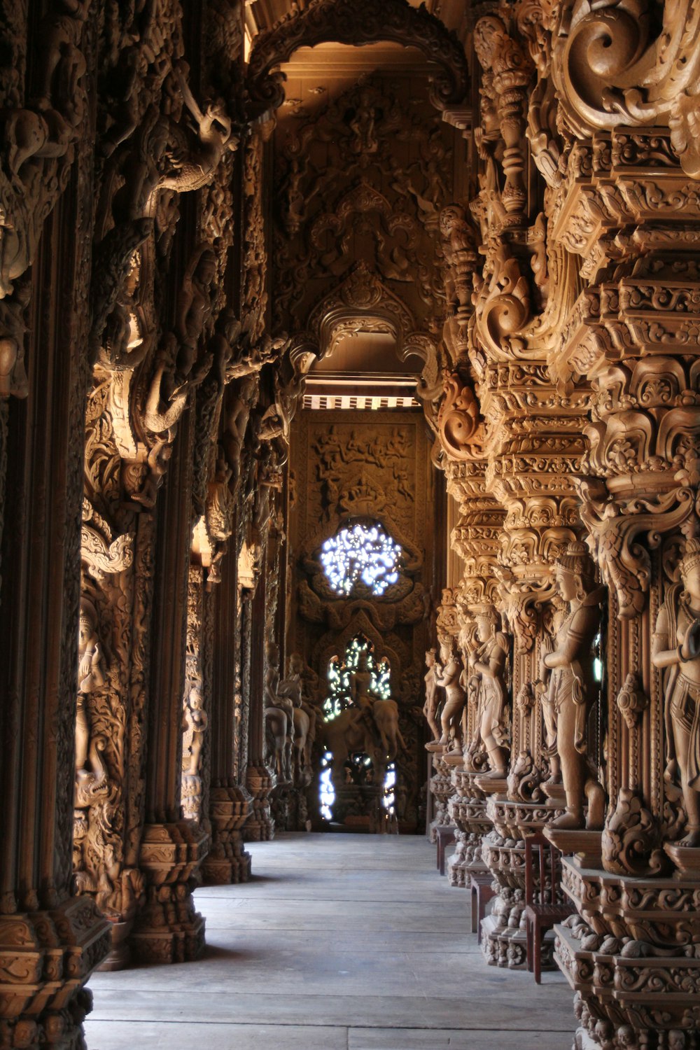 a long hallway with intricate carvings on the walls