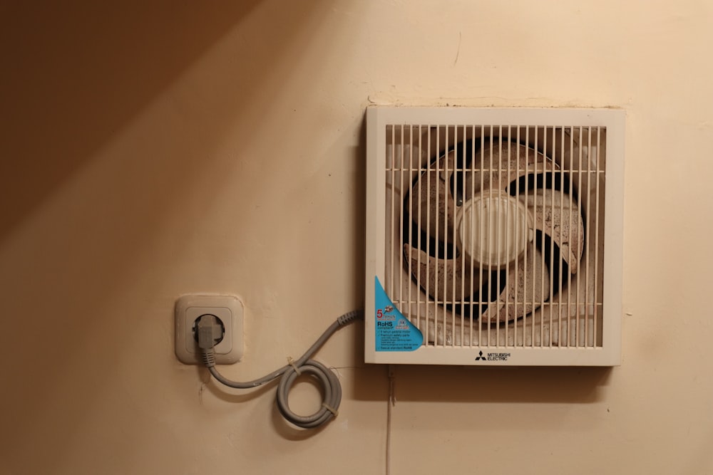a wall mounted air conditioner mounted on a wall