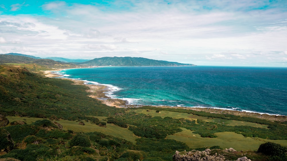 a scenic view of the ocean and a golf course