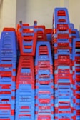 Stackable chairs ready for transport at an event.