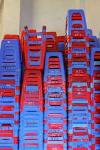 Stacks of commercial office furniture neatly arranged for bidding.