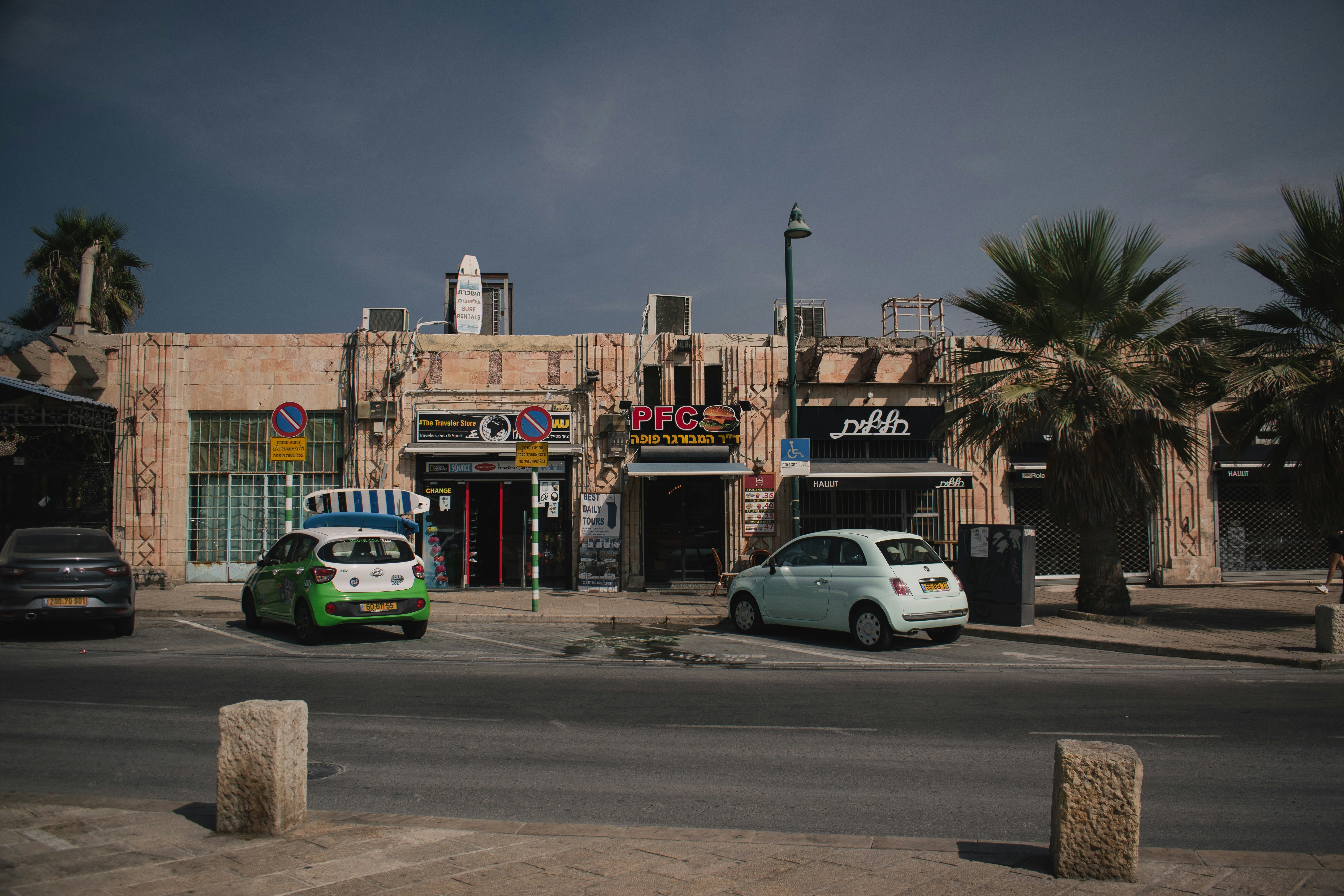 a small car parked in front of a building
