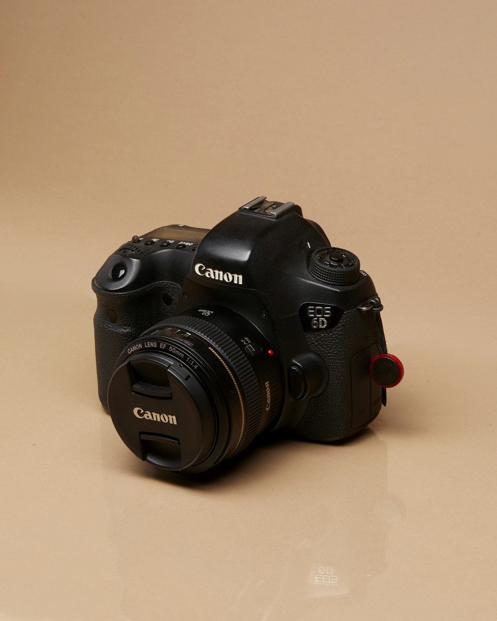 a black camera sitting on top of a table