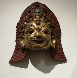Ancient mask from the Baoulé region, representing cultural artistry and ancestral spirits.