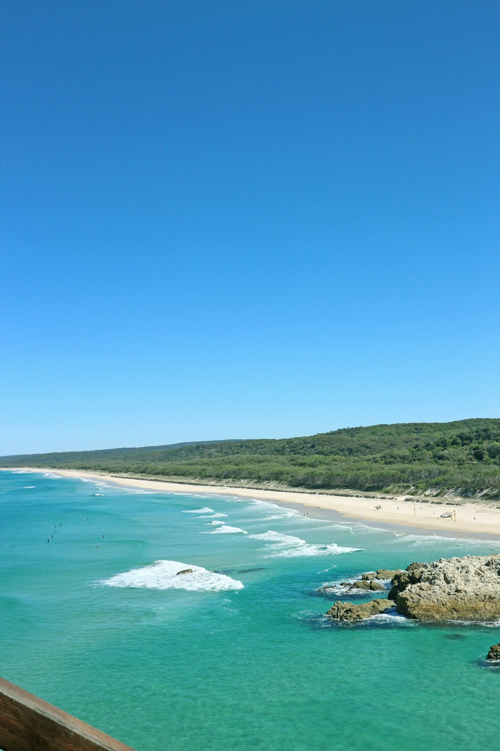 a view of a beach from a bridge