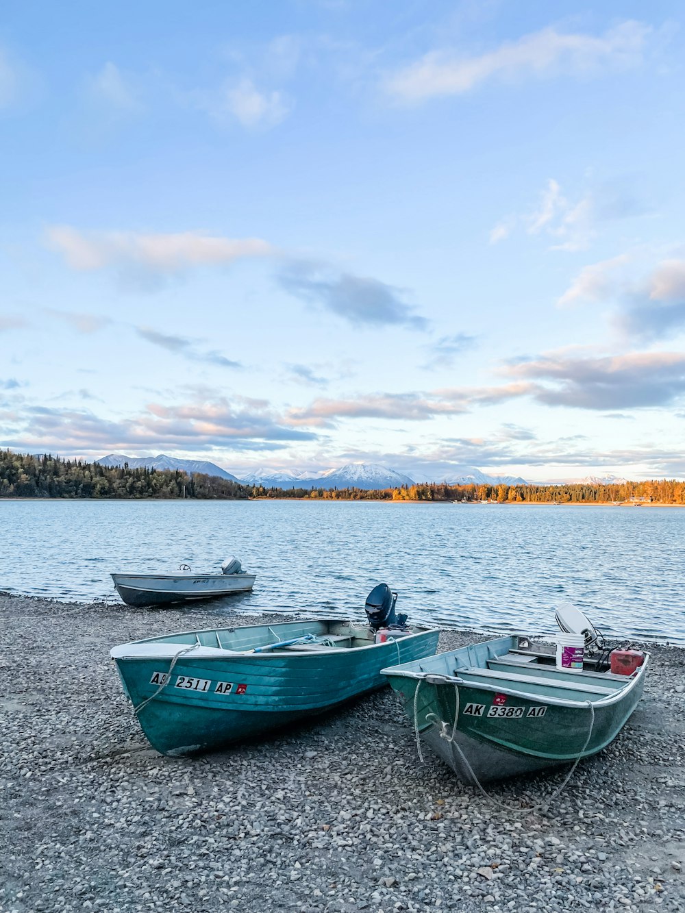 a couple of small boats sitting on top of a beach