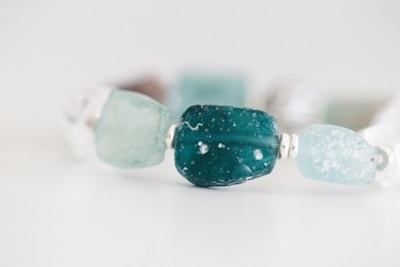 a close up of a bracelet made of glass beads