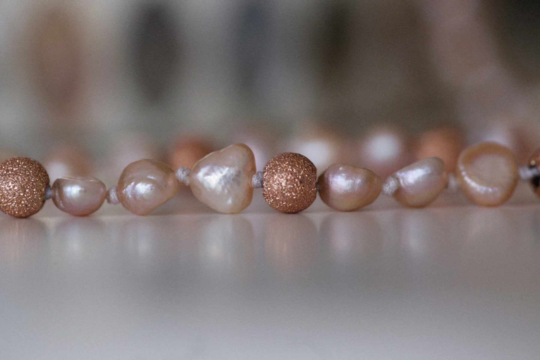 Close-up of luminous baroque pearls showing varied nacre surfaces and lustre