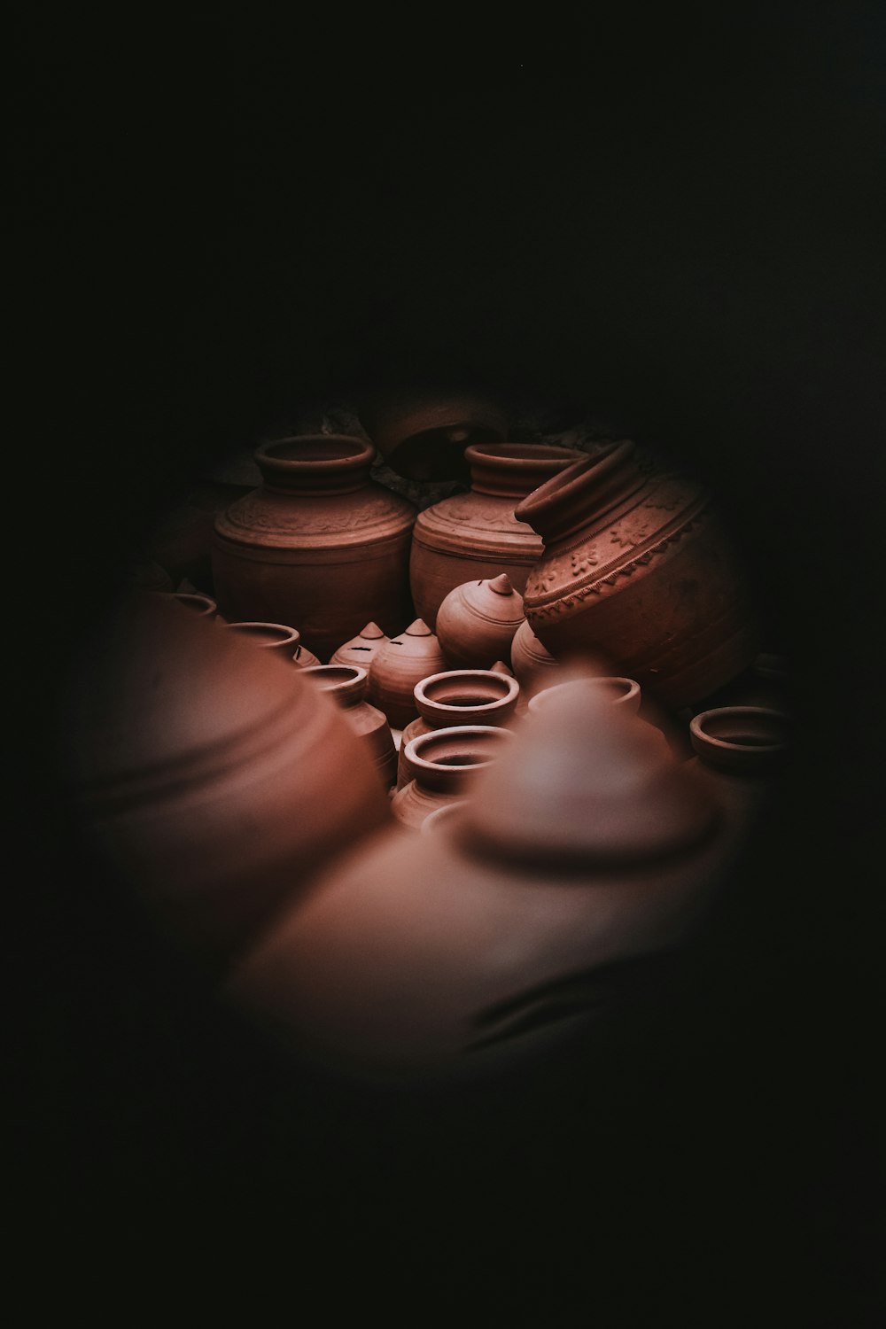 a group of clay pots sitting on top of a table