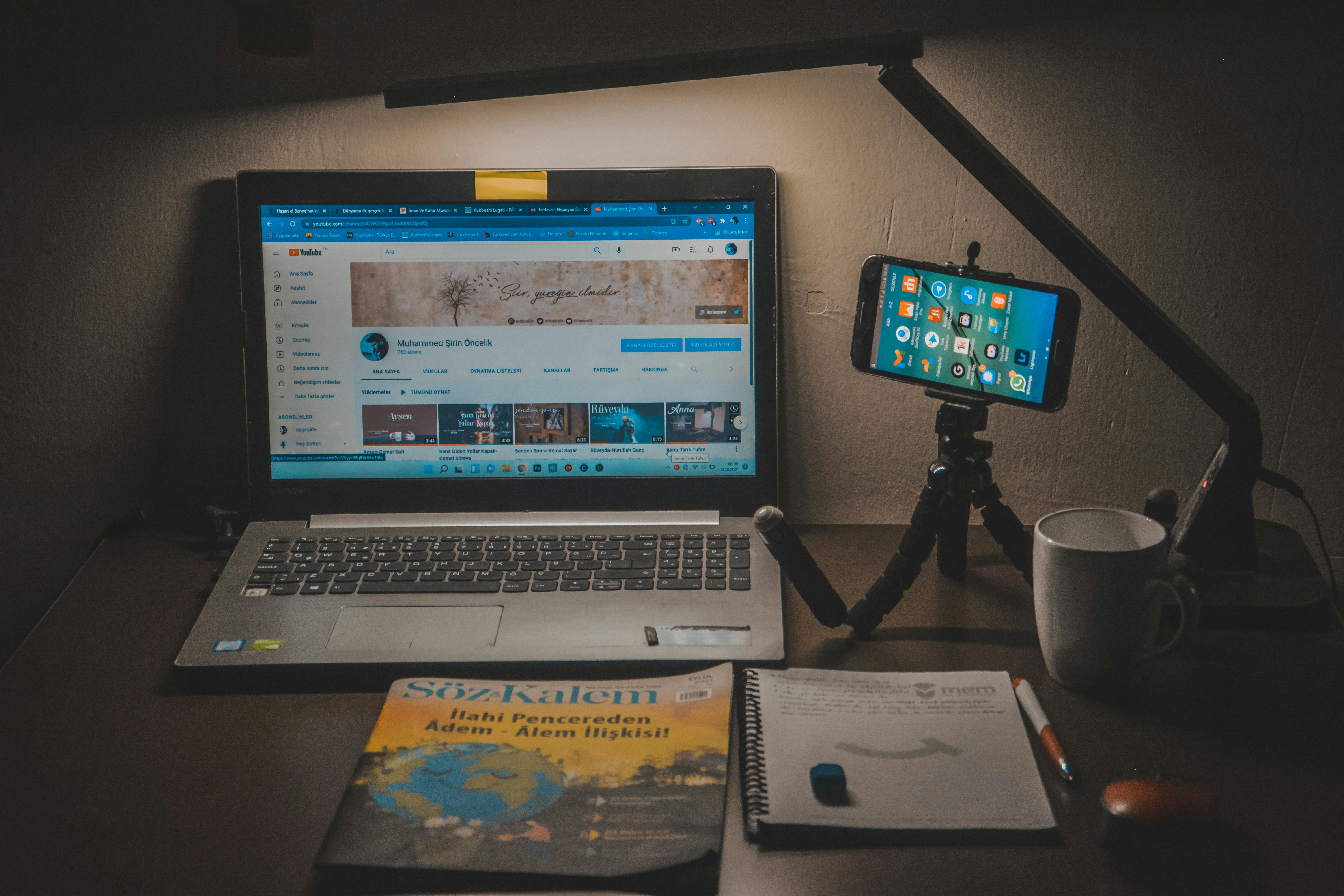 a laptop computer sitting on top of a desk