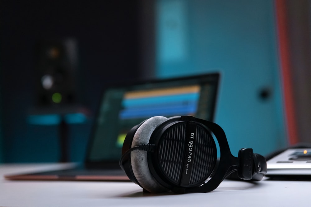 a pair of headphones sitting on top of a table