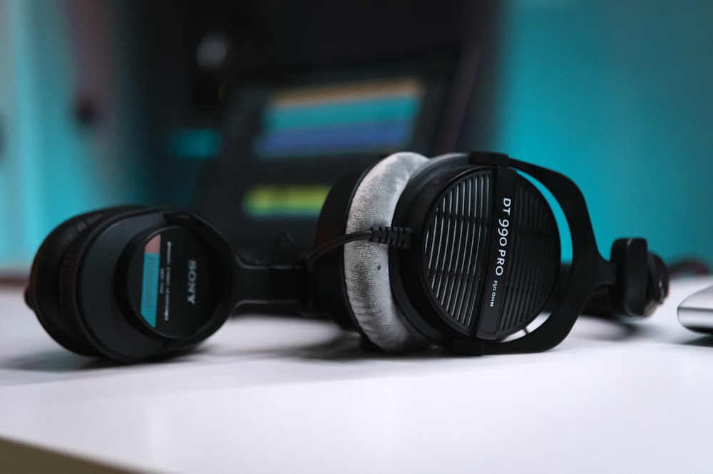 a pair of headphones sitting on top of a table