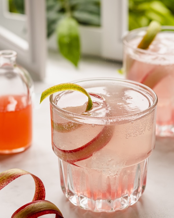 A close up of a drink in a glass on a table