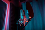 a microphone with a red light shining on it