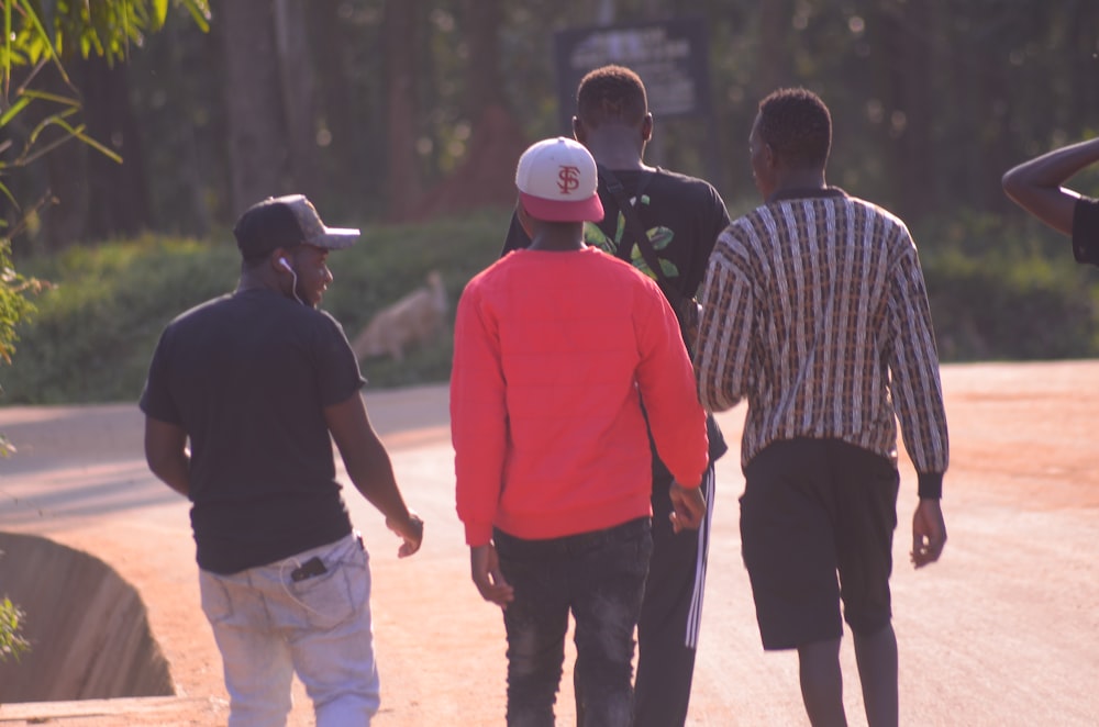 a group of young men walking down a street