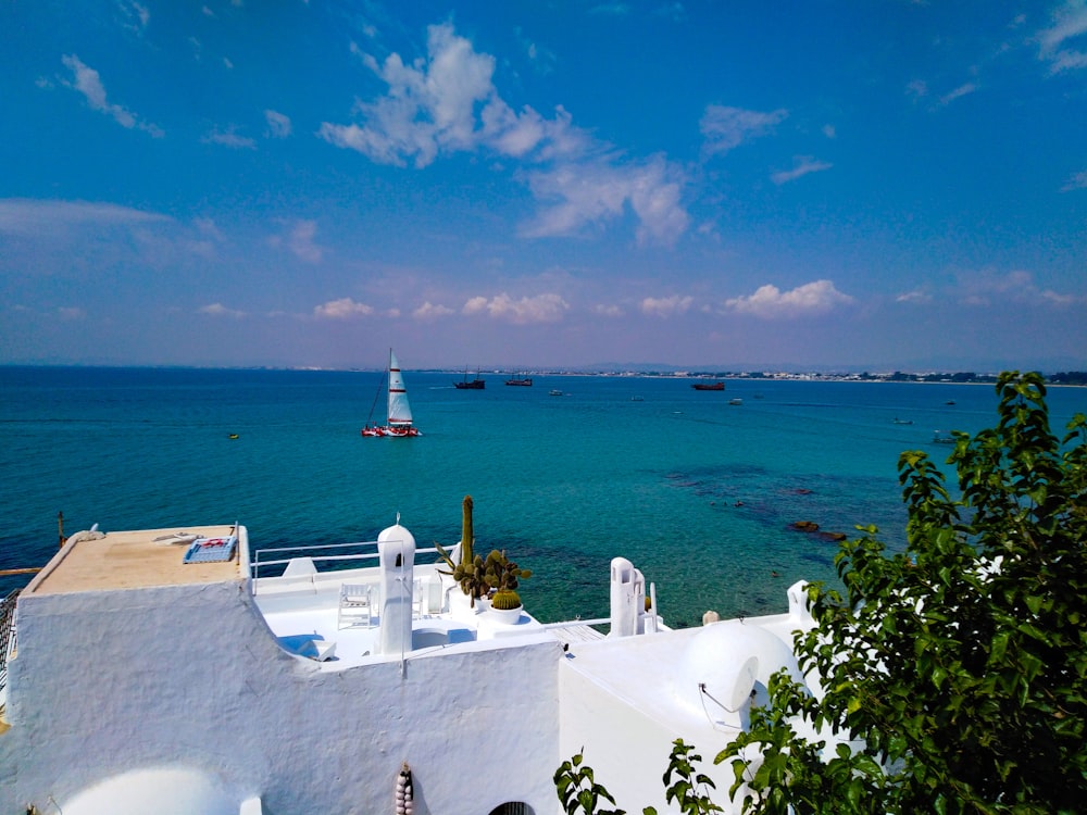 a view of a body of water with a lighthouse in the distance