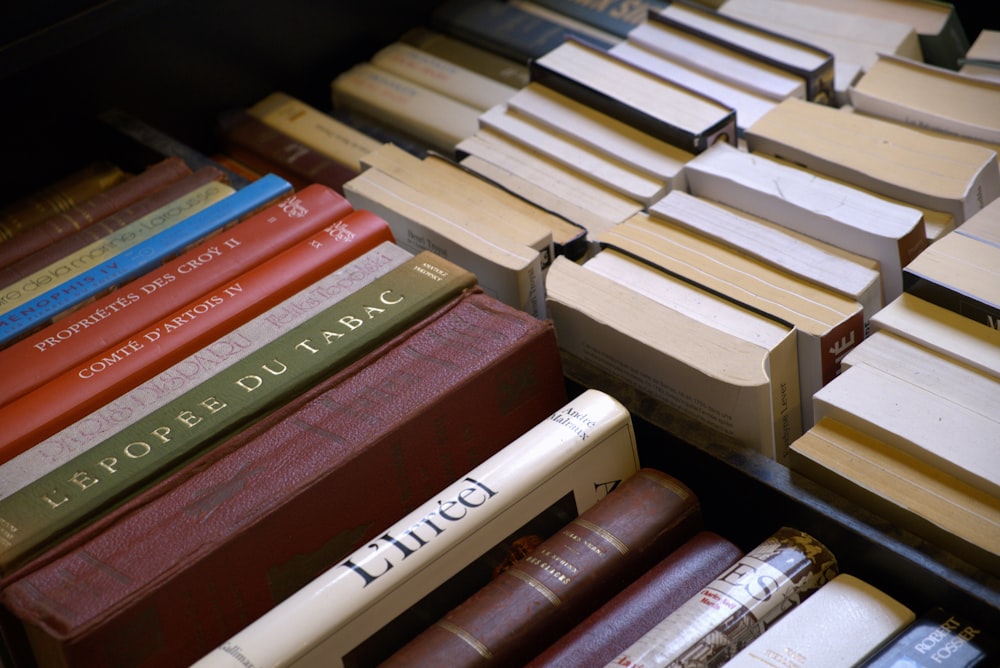 a pile of books sitting next to each other