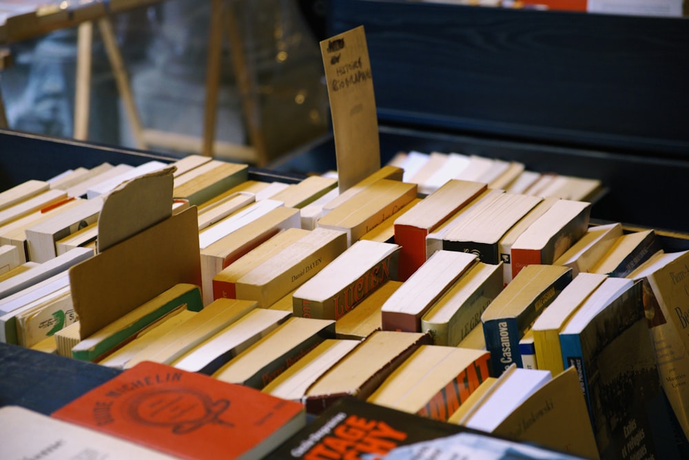 a pile of books sitting on top of a table