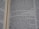 Open book displaying a passage from the Bible with a focus on the text centered on the page. The text is in black font on white paper, with some underlined words indicating emphasis.